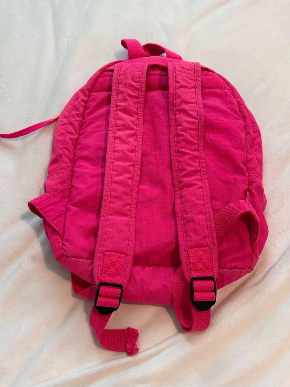 Vibrant Pink Kipling Backpack with Monkey Charm